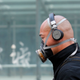A man in Beijing wears one of the more involved face mask options.